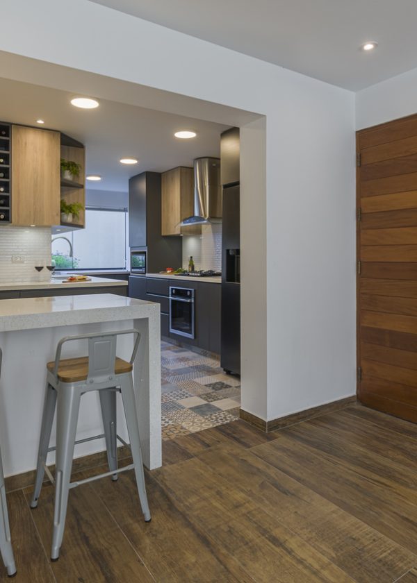 American model kitchen remodeled with good lighting, ample cabinets and rustic style tiles.